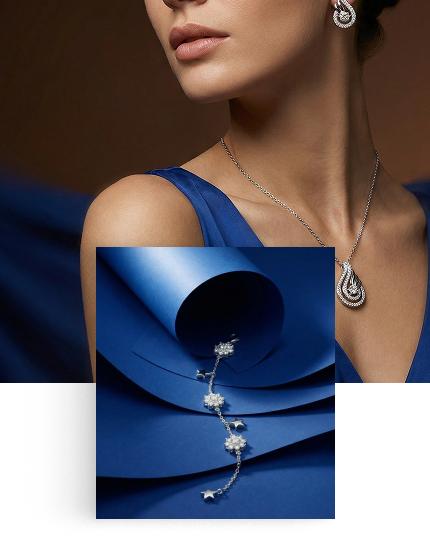 Silver Jems model wearing pendant and earrings, with star bracelet on blue fabric — mobile