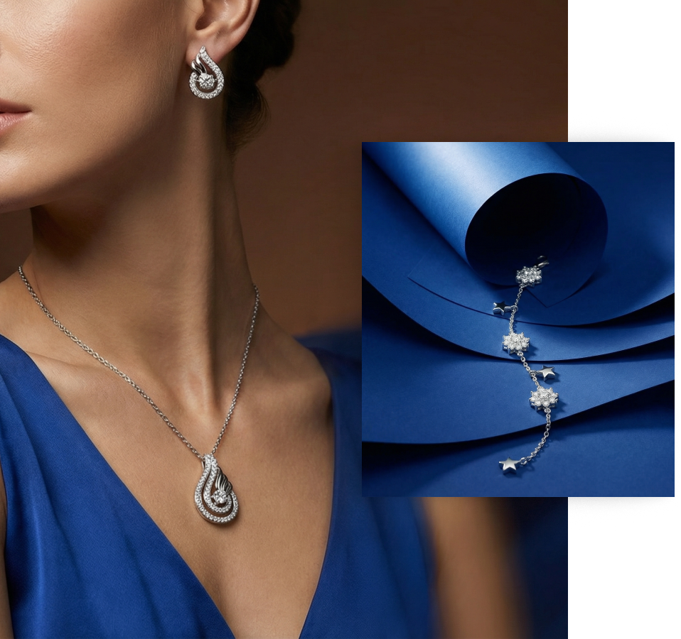 Silver Jems model wearing a silver pendant and earrings alongside a star bracelet on blue satin fabric