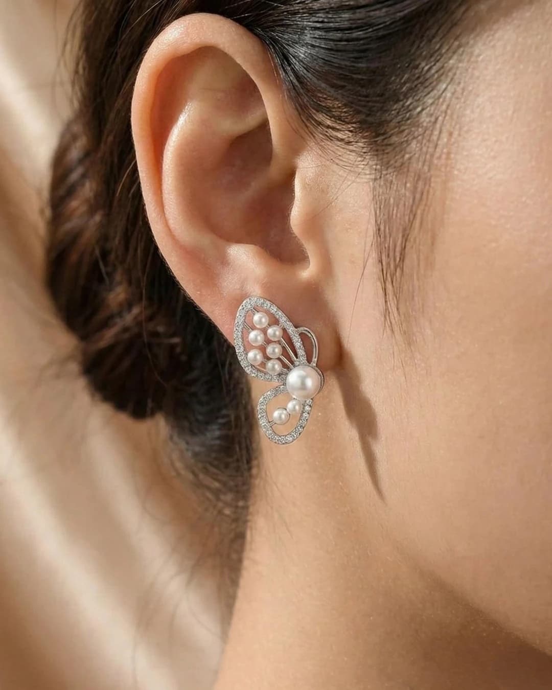 Graceful Butterfly Pearl Stud Earrings – 925 Sterling Silver — model