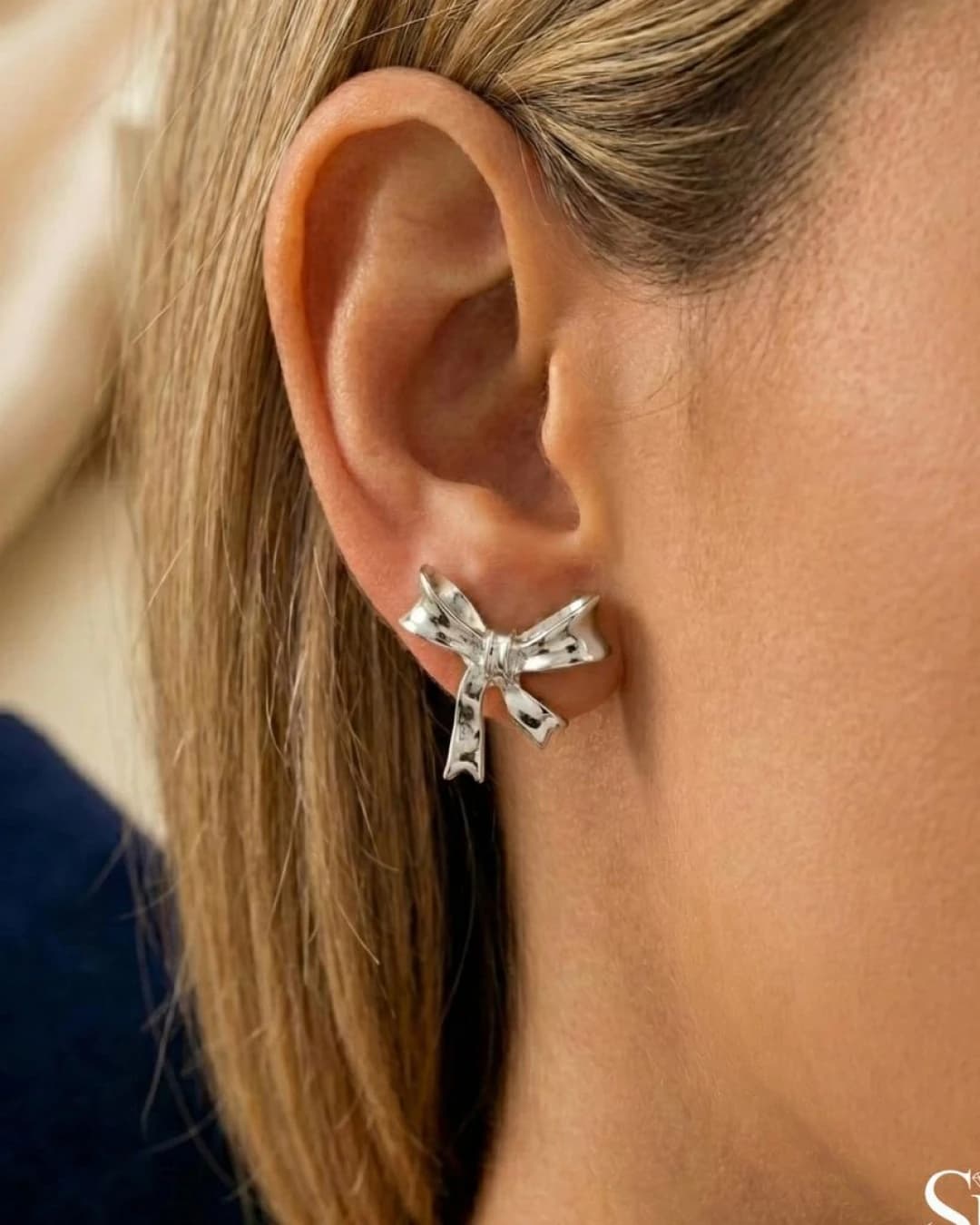 Polished Ribbon Bow Stud Earrings – 925 Sterling Silver — model